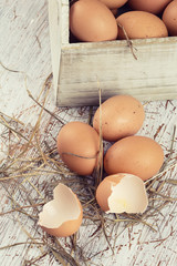 Chicken eggs on wooden background