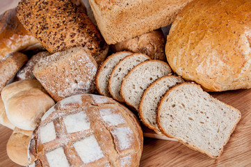 Group of different bread's type on wooden table