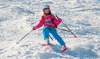 Fototapeta na wymiar Child skiing in sharp cornering