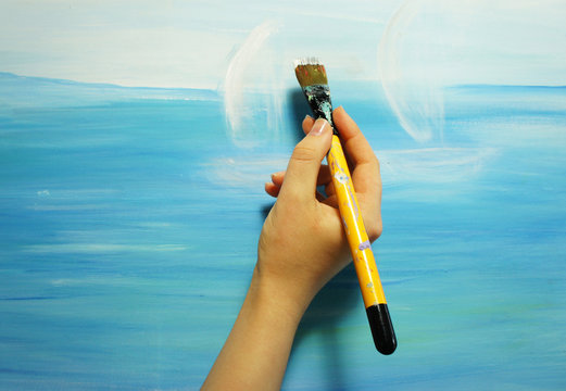 Painter paints his beautiful picture
