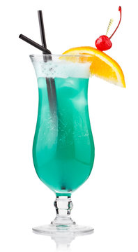Turquoise alcohol cocktail with berries and orange slice isolate