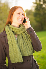 Woman with Mobile Phone in Nature