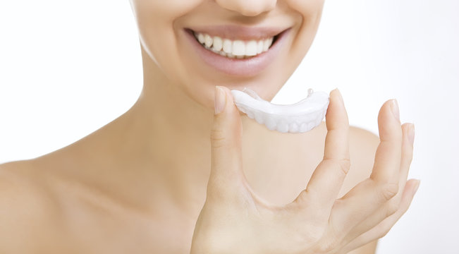 smiling girl with tooth tray