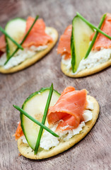 Canapes with smoked salmon, cucumber and  cream cheese