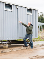 Man opening a hut site