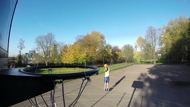 Basketball player taking a 3 point jump shot in slow motion