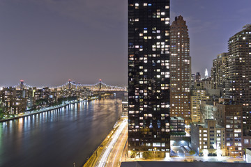 Fototapeta na wymiar New York City night panorama with river reflections