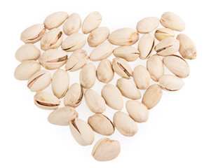Heap of pistachios nuts isolated om the white