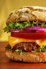 Multigrain bun cheese burger , vertical