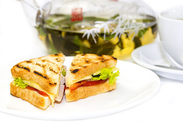 sandwich with tea on a white background in restaurant