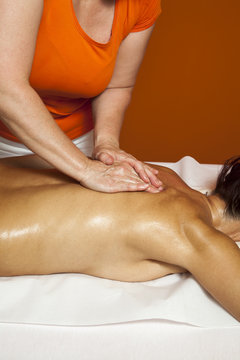 Woman receiving therapeutic massage and lymphatic drainage