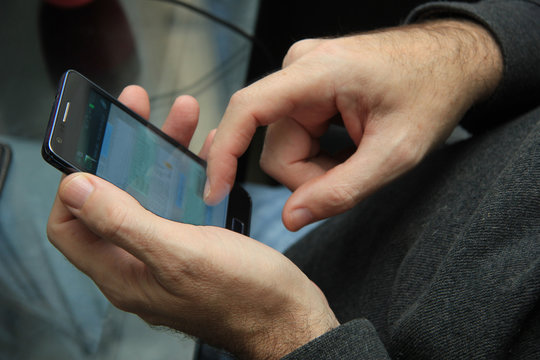 Man with smartphone - Powered by Adobe