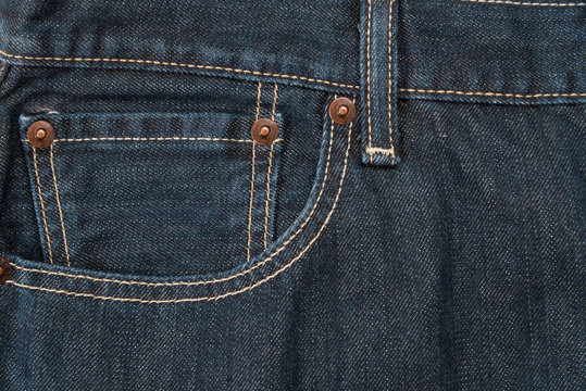 pocket and waistband of denim blue jeans as a background