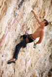 Rock climber on a face of a cliff