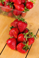 Many strawberries on wooden table