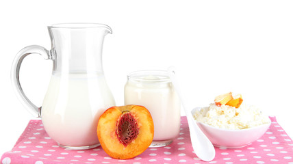 Fresh dairy products with peaches isolated on white
