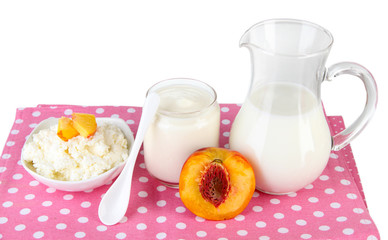 Fresh dairy products with peaches isolated on white