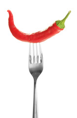 Obraz na płótnie Canvas Red hot chili pepper on fork, isolated on white