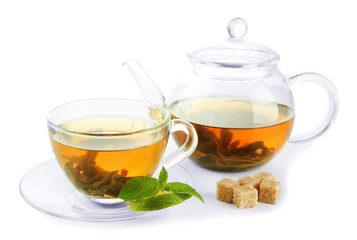 Cup and teapot of green tea with mint and sugar isolated