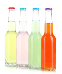 Drinks in glass bottles isolated on white