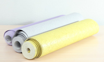 Wallpapers on wooden table in room