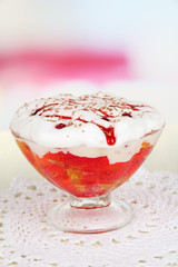 Tasty jelly in bowl on table on light background