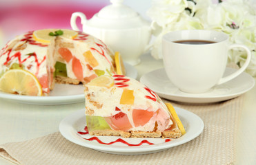 Delicious jelly cake on table close-up