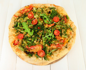 Tasty vegetarian pizza on wooden table