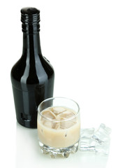 Baileys liqueur in bottle and glass isolated on white