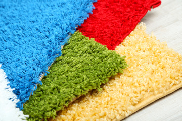 Many carpets of different colors close-up