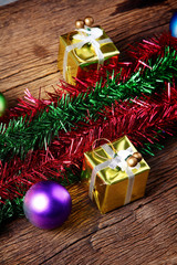 Fototapeta na wymiar Christmas decoration with presents on wood board