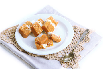 Sherbet with nuts on plate isolated on white