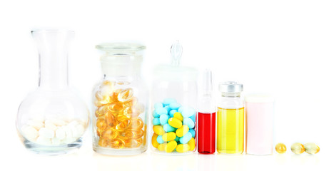 Medical bottles and pills isolated on white