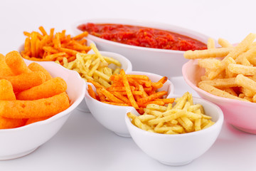 Potato, corn and wheat chips in bowls