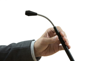 a hand holding a microphone