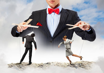 Businessman puppeteer