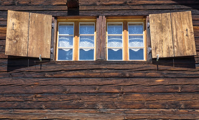 Two windows of a wooden hut