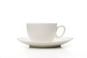 A simple white porcelain tea or coffee cup viewed from profile, isolated on white background