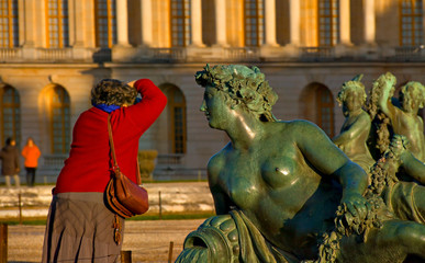 Statue du château de Versailles et photographe