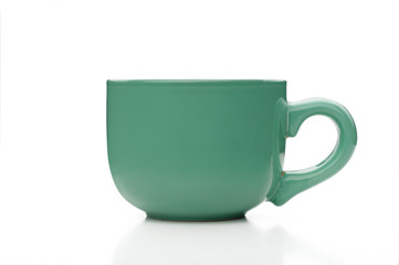 A simple green tea cup viewed from profile, isolated on white background