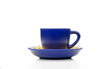 A simple blue espresso cup viewed from profile, isolated on white background