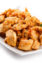 Grilled meat and vegetables on white background