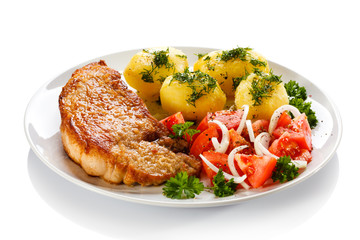 Grilled steak, boiled potatoes and vegetable salad