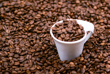 Cup filled with coffee beans