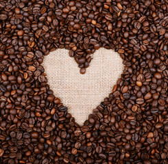 Heart coffee frame made of coffee beans on burlap background