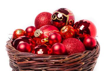 Red christmas balls in wicker basket