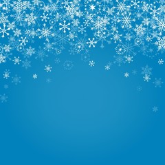 Fototapeta na wymiar Falling snowflakes on blue background