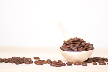 coffee beans on wooden surface