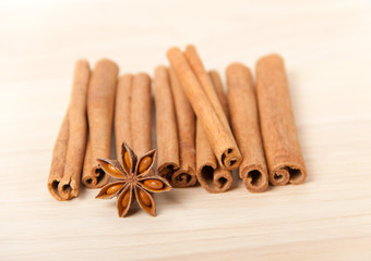 cinnamon and star anise on wooden background