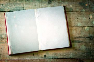 Obraz premium open book with golden glitter lights